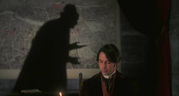 Dracula’s shadow, looming behind Harker.